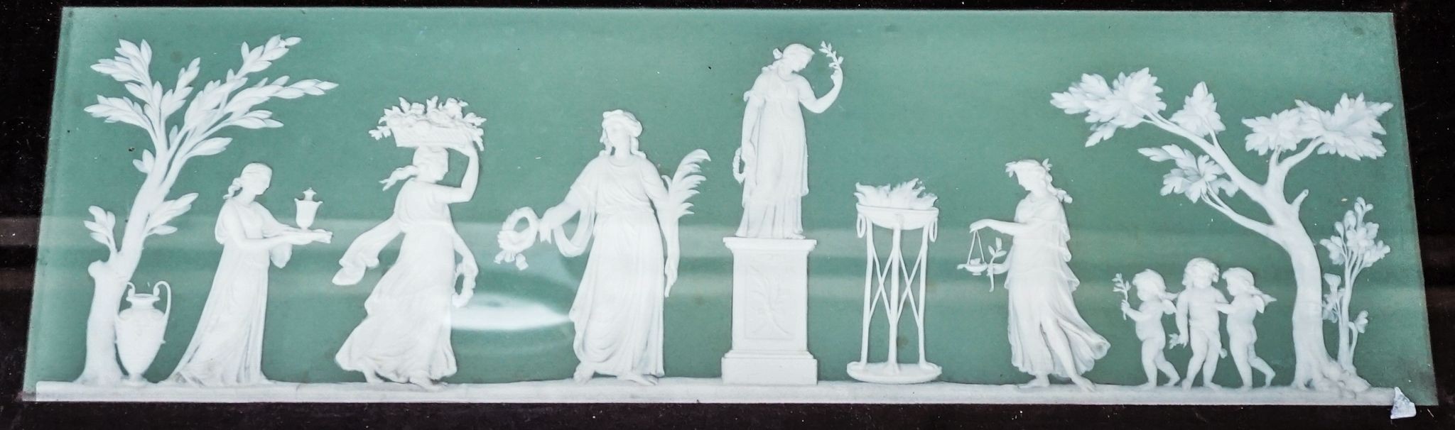 A Wedgwood jasperware plaque, framed. 15x48cm excl. frame